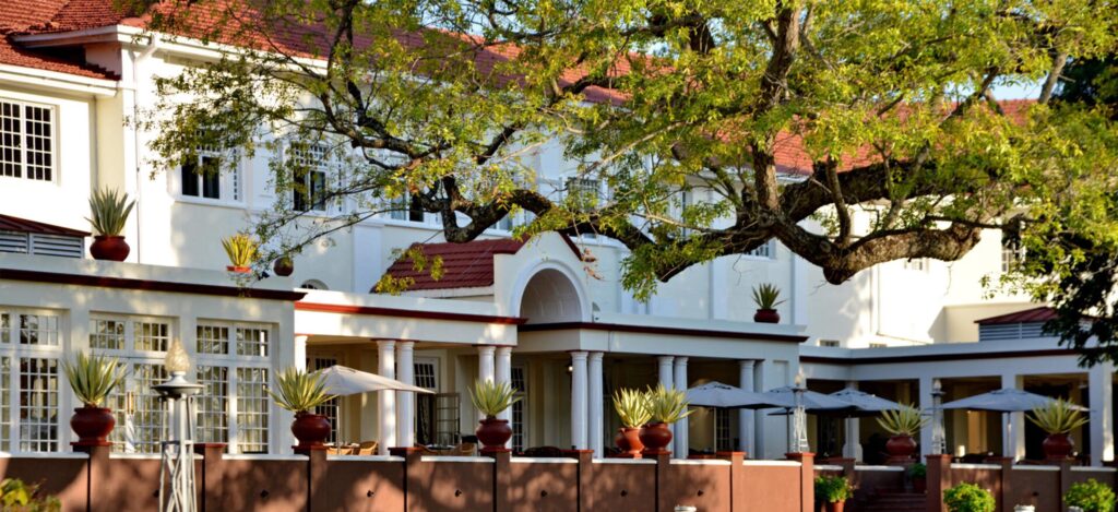 Historic Victoria Falls Hotel exterior view — a top luxury choice for travelers searching where to stay in Victoria Falls